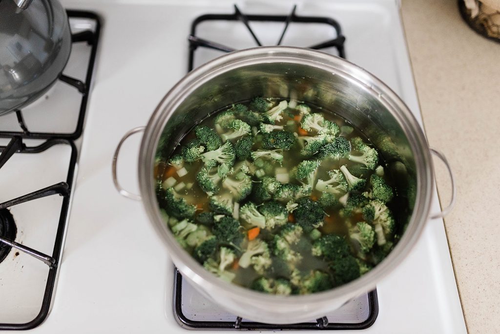 Photo of all the chopped veggies in a pot boiling. 