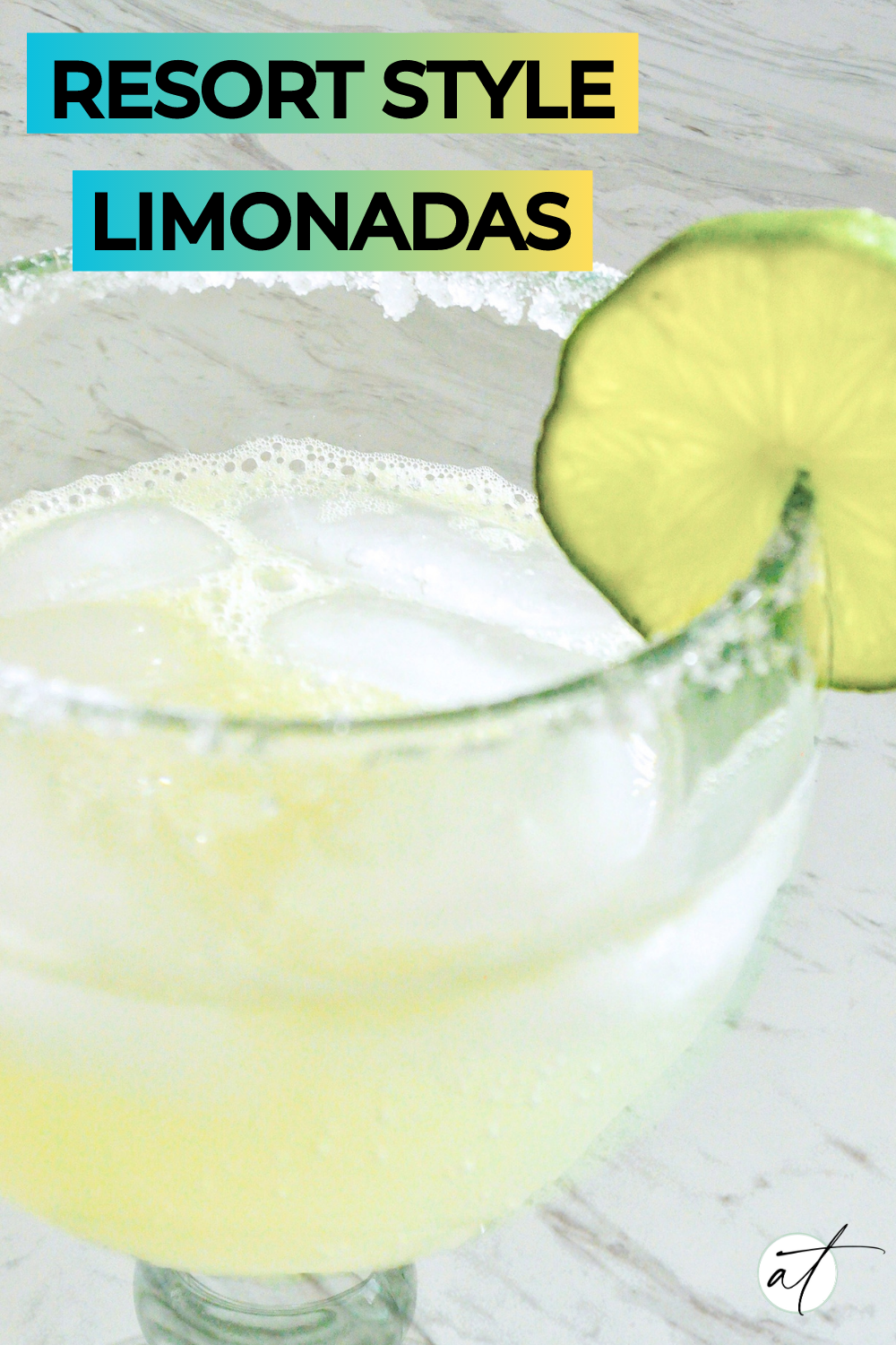 Photo of Mexican Limonada served in large margarita class with a sugar rim and fresh lime.  