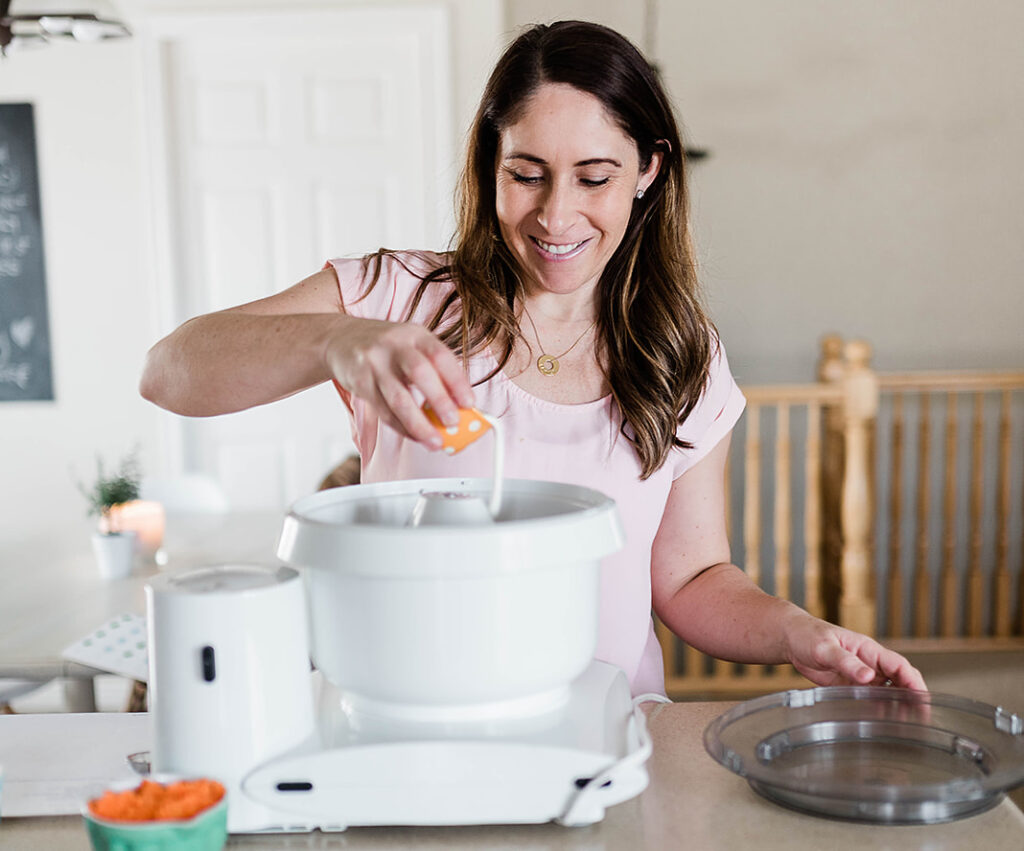 photo of Andie slowly adding the heavy whipping cream to get just the right texture for her carrot cake dip. 