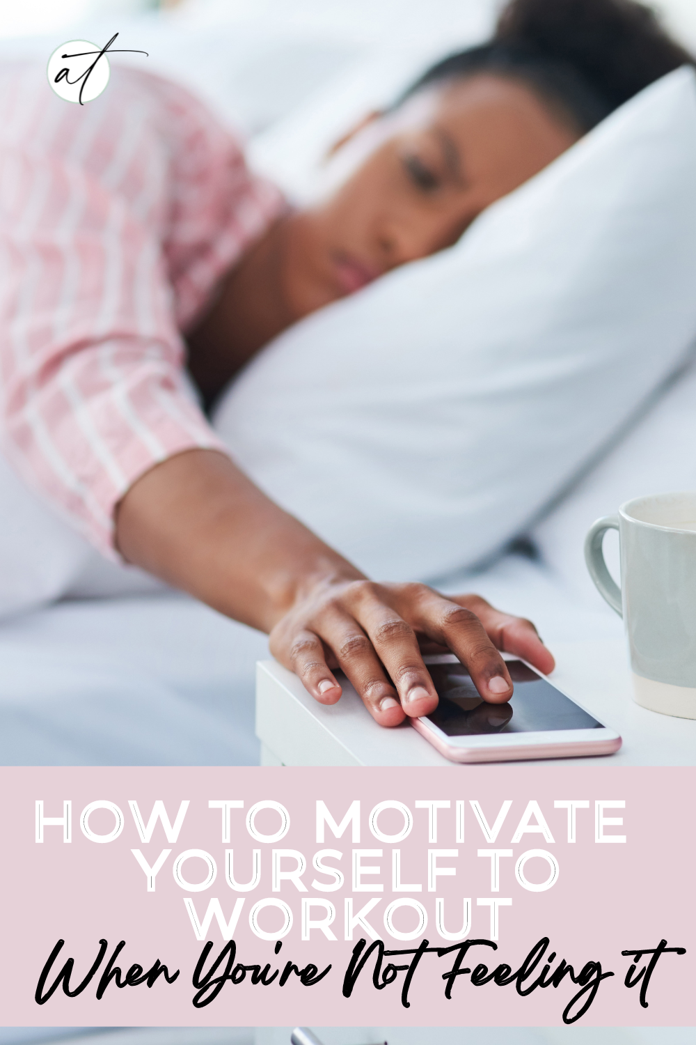 Photo of woman in bed, groggy reaching for her phone trying to muster up the motivation to work out. In this post Andie's answers the question: how to motivate yourself to work out