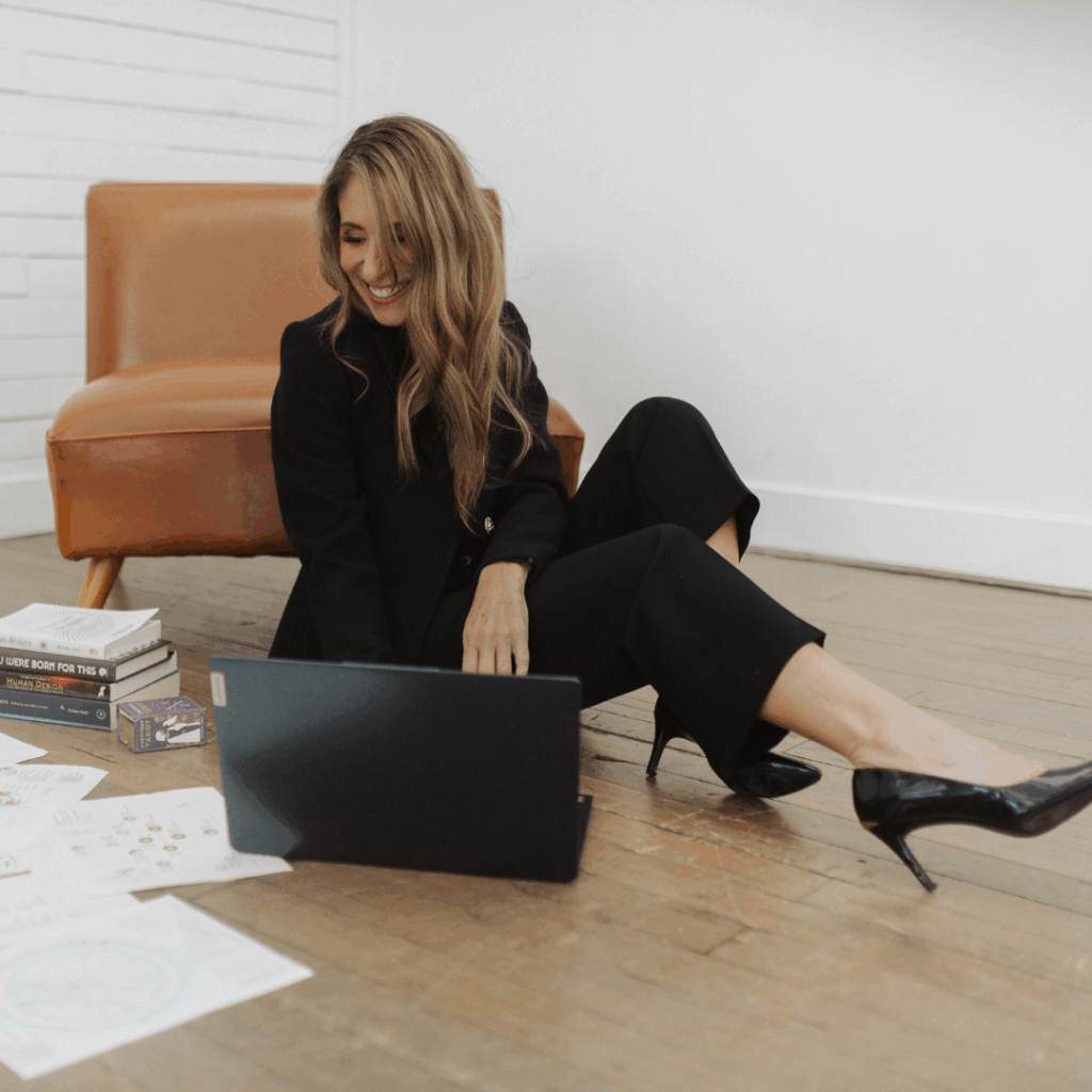 Andie on her computer working on prepping for a Soul Purpose Coaching session.